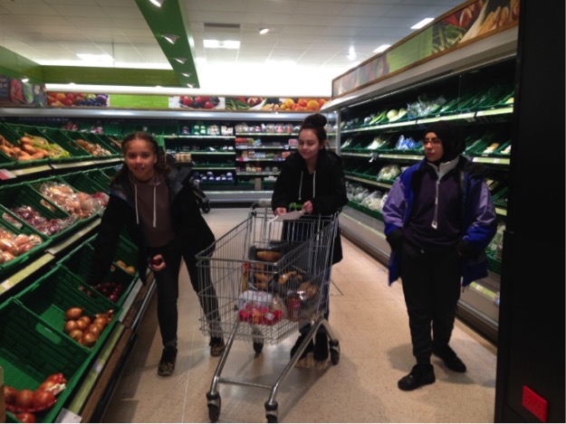 Three girls shopping for supplies